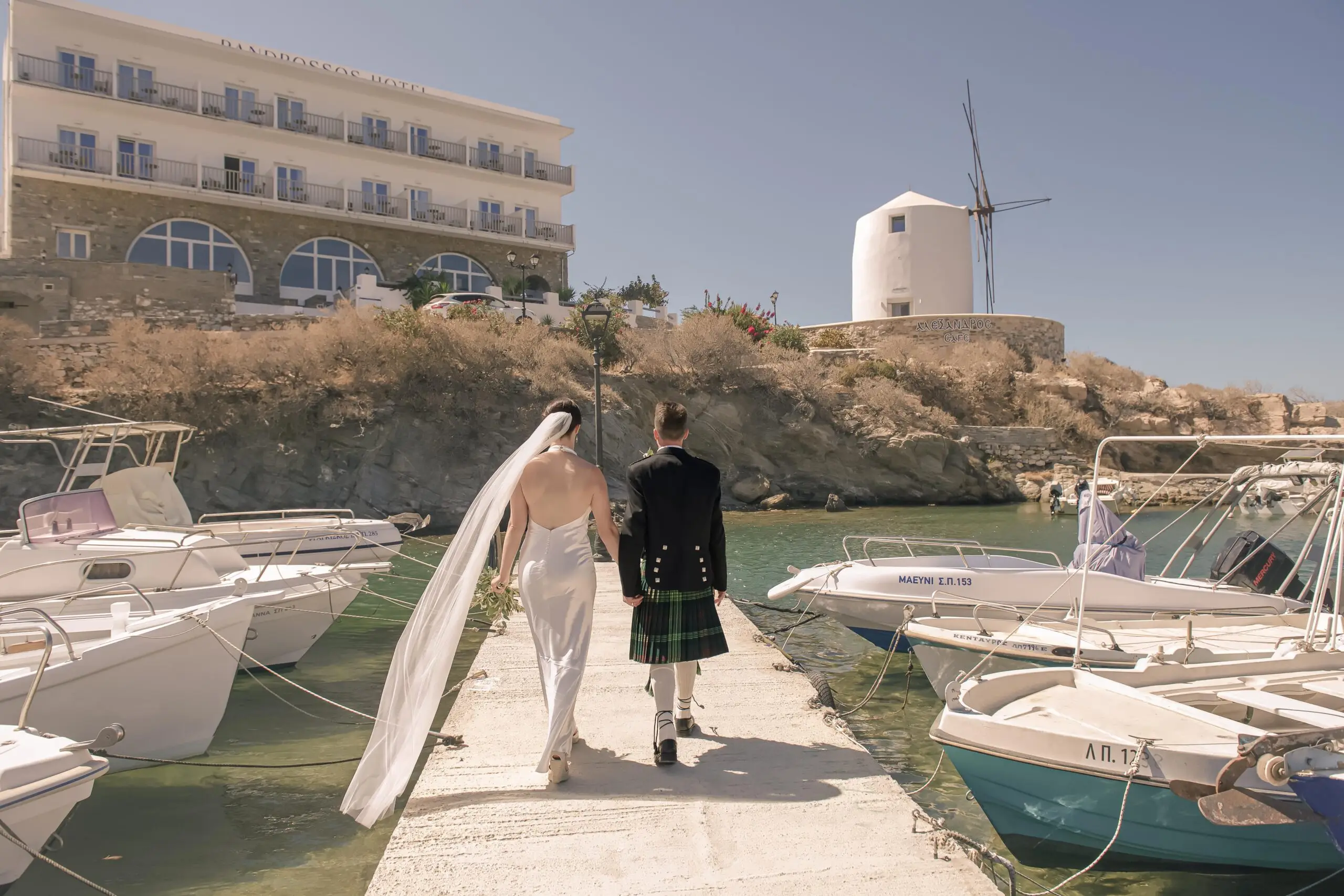 wedding-photography-paros-couple-walking-pier