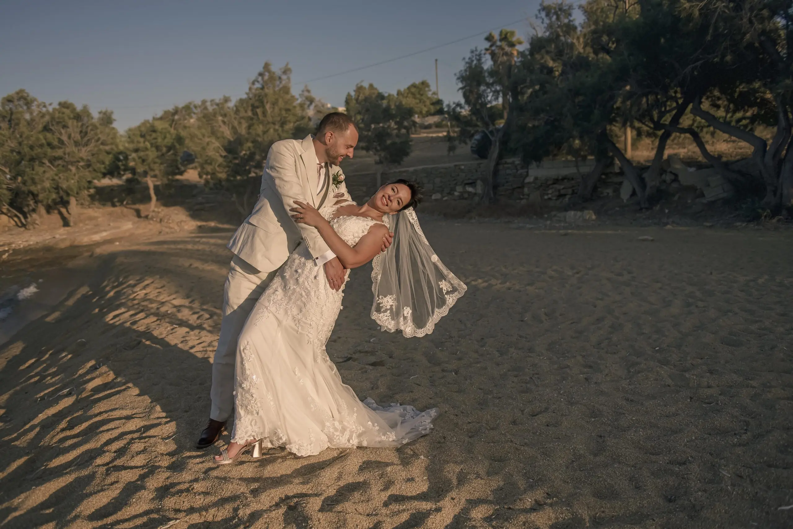 wedding-couple-beach-dip-paros-sunset